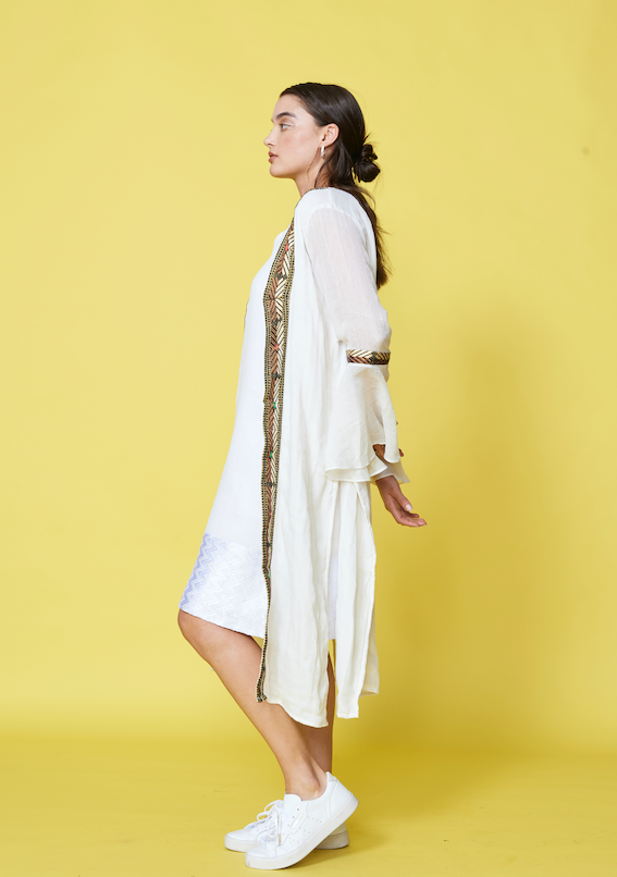 
                  
                    Embrace Fall's essence with our hand-woven Ease Cardigans - a celebration of artisanal craftsmanship. Crafted from organic cotton, these delicate cardigans offer comfort and sustainability akin to a precious pearl. The flared sleeves add an elegant touch, inviting graceful movements and a charming twirl. #BlackFridayFashion #EthiopianCraftsmanship #ArtisanalFashion #FallStyle #SustainableFashion #LimitedTimeOffers #GetItFirst #ShopSmart #UnbeatablePrices
                  
                