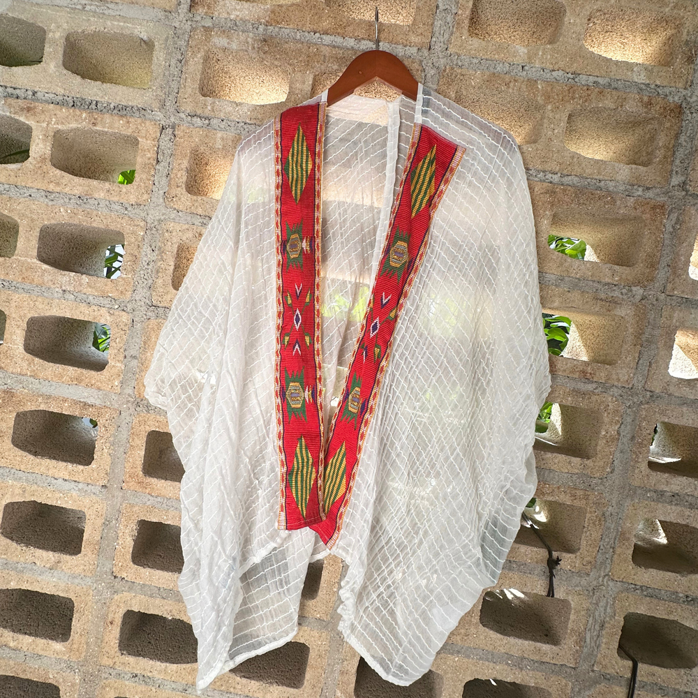 
                  
                    Handwoven Red Sea/Firely Kaftan with contemporary flair. Ideal for spring/summer, pairs effortlessly with jeans or a dress. Effortless chic for every day.
                  
                
