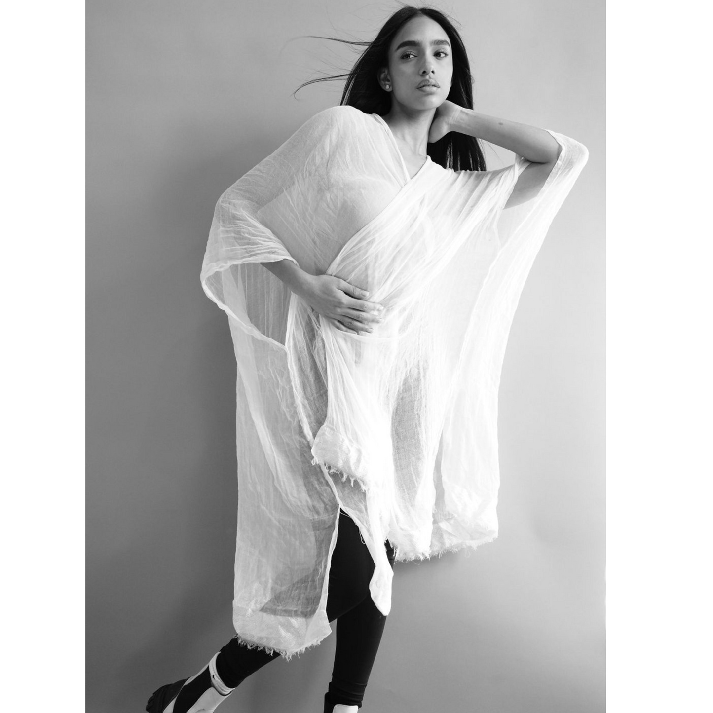 Discover Adey Abeba's Pure White Kaftan – chic, comfy, and empowering. With side slits and a gold belt, it adapts to your style effortlessly. Crafted from organic cotton for comfort and sustainability. Elevate your look with this conscious fashion choice