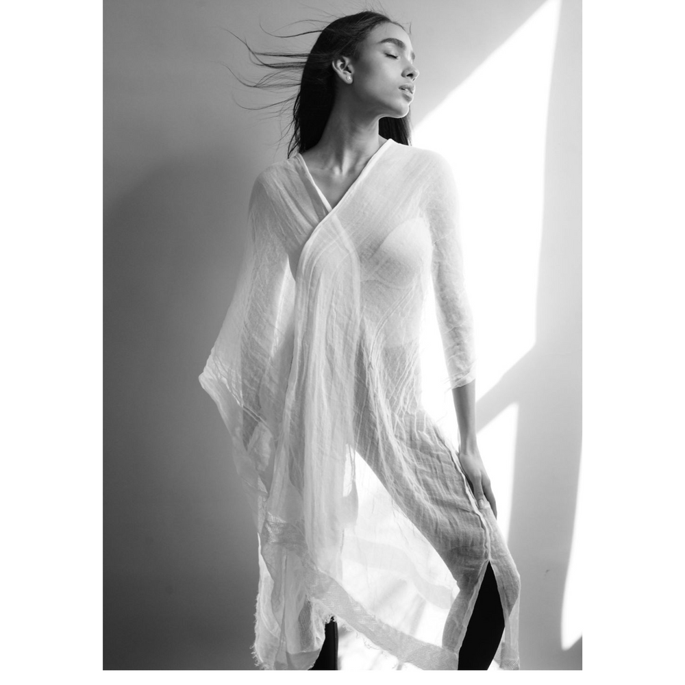 
                  
                    Discover Adey Abeba's Pure White Kaftan – chic, comfy, and empowering. With side slits and a gold belt, it adapts to your style effortlessly. Crafted from organic cotton for comfort and sustainability. Elevate your look with this conscious fashion choice
                  
                