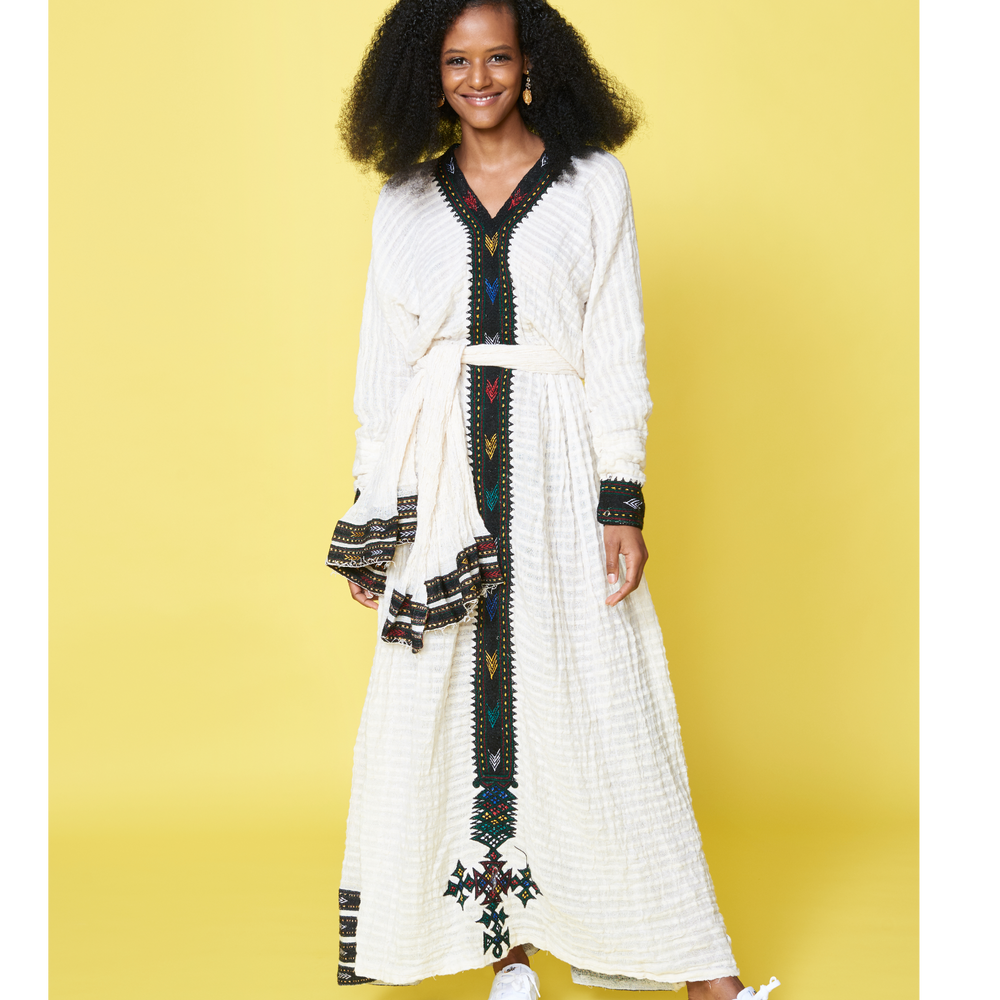 
                  
                    Amazing, traditional Be‘al attire worn for weddings, special occasions, and holidays throughout the world. The neck-down embellishment uses traditional Ethiopian and Eritrean embroidery techniques. Long sleeves with a waist wrap and head scarves are ideal for the holiday. Being made of 100% cotton, you will be simply effortless stylish and cultural . Ethiopian New Year Eritrean new York  meskel meronmamo Adey Abeba Ethiopian holiday
                  
                