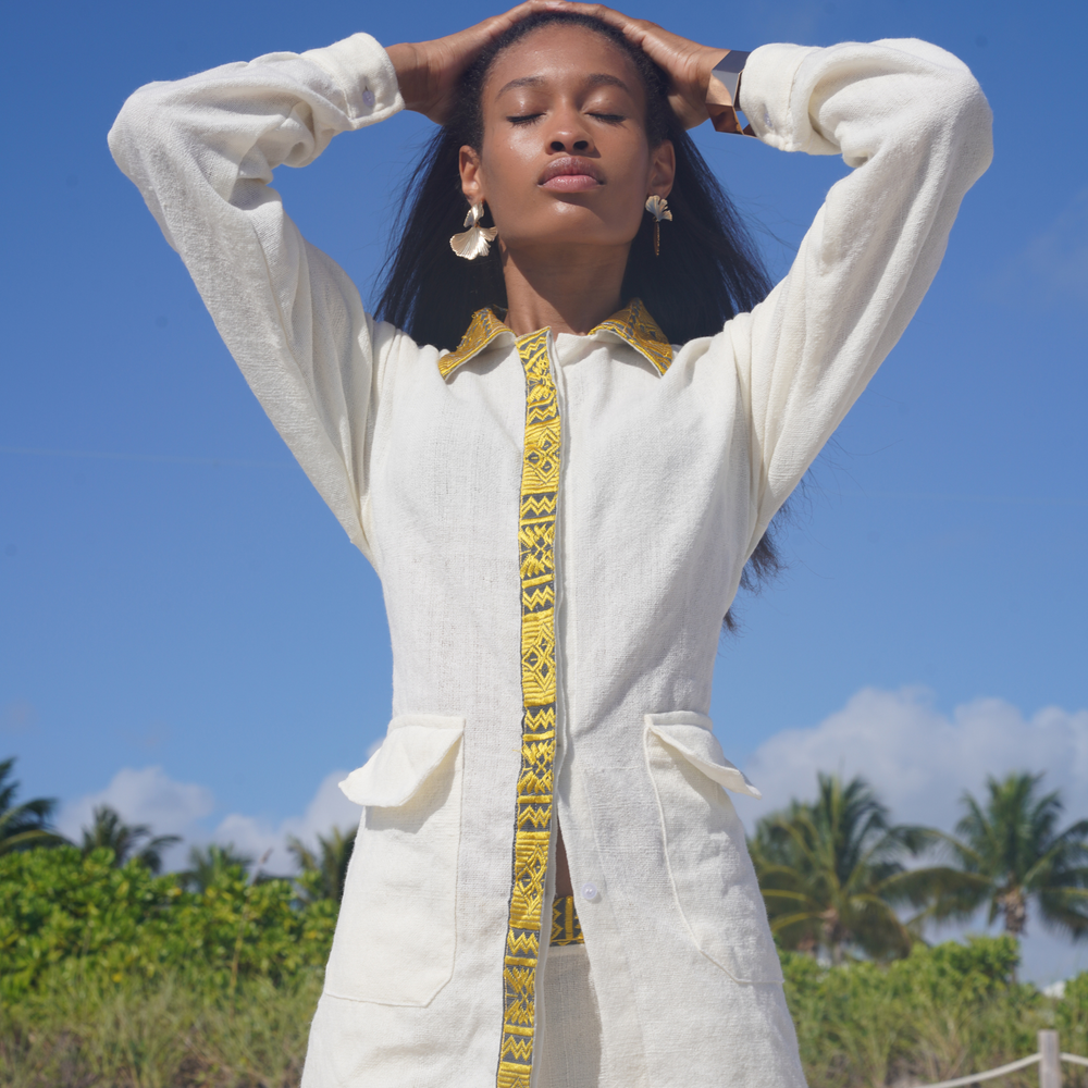 
                  
                    Discover the Hayilenya Suit: timeless elegance blending intricate details and tradition. Handmade with exquisite embroidery, it celebrates craftsmanship, ideal for Black History Month and Valentine's Day.  Each thread tells a tale of sustainability and artistry. Handwoven with premium materials, it offers comfort and durability. Elevate your wardrobe with the Unisex Hayilenya Suit—a sophisticated addition radiating confidence and grace.
                  
                