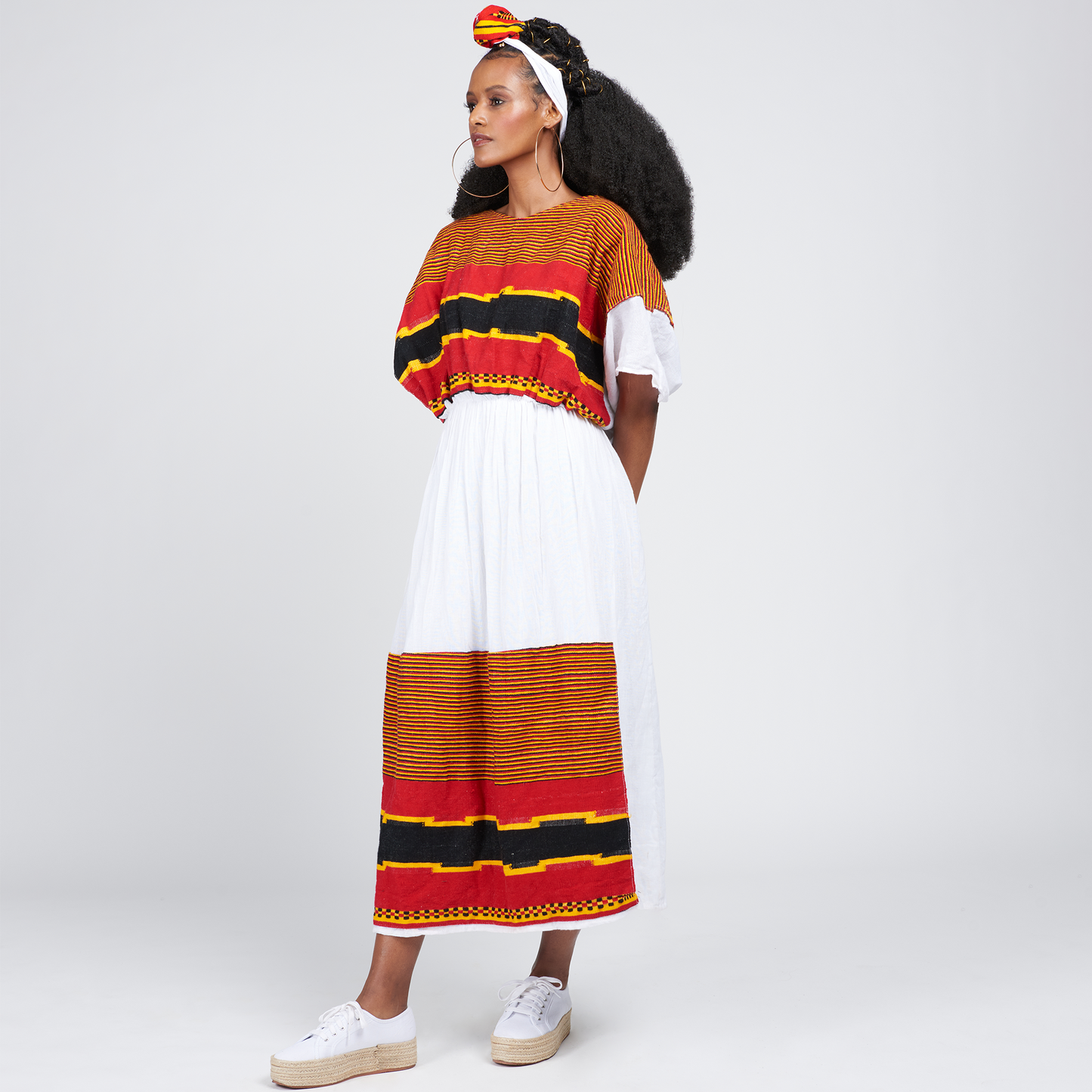 
                  
                    Meri Wolaita Dress is Wolaite culture-influenced style with a modern touch. Wolaita is part of Ethiopia located in southern Ethiopia known for national music, dance, and cuisine. Complete the look with the Netela as a head-wrap or by wrapping it on your waist. Meri Wolaita Adey Abeba Ethiopian Dress Adey Abeba Kemis Ethiopian Dress collection Ethiopian fashion dress Couture Traditional fall 2023 Meron Mamo
                  
                