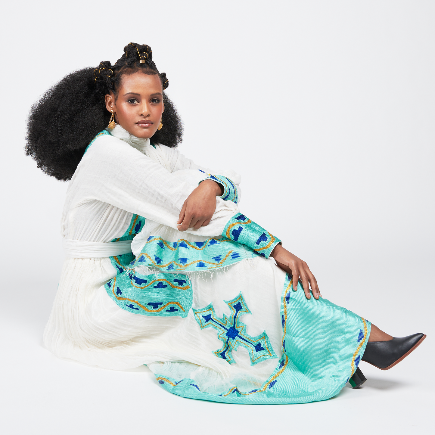 
                  
                    Azeb dress, a traditional Ethiopian garment with Alem Tibeb (Ethiopian Embroidery), celebrates Black History Month and Valentine's Day. V-neck, full sleeves, 100% cotton. Includes Netela (Scarf). Perfect for special occasions. Dry clean or hand wash.
                  
                