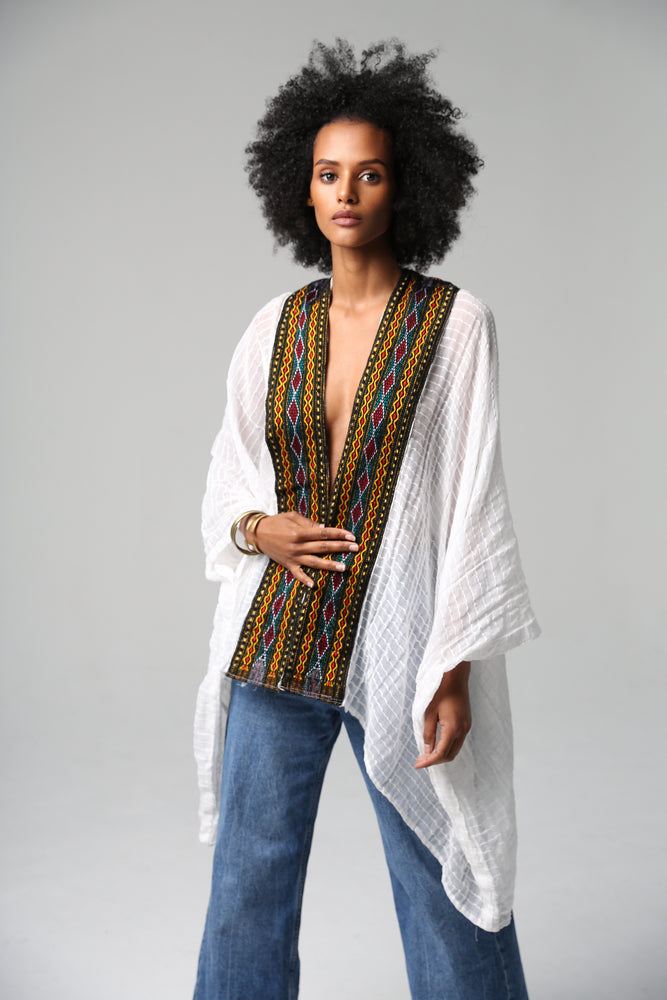 Our Firely Cardigan is handwoven using traditionally embroidering techniques and we contemporized it for every wear. Perfect for this spring/summer with jeans and a top, or a dress. Made it stylishly so you can always be effortlessly chic and in style. #ss22  meronmamo handwoven handcrafted Handmade sustainablefashion qualityafricanclothing adeyabebaofficial adeyabeba mmeron3 Shamayim firelycardigan slowfashion